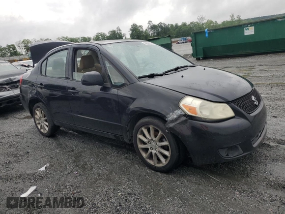 2011 Suzuki SX4 LE z VIN JS2YC5A28B6300625, wystawiony jako Copart lot #54044155 z przebiegiem 179 269 mil mil oraz Szkoda całkowita • Salvage title. Historia ofert i sprzedaży dostępna na DreamBid. Obrazek 4.