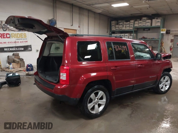 2014 Jeep Patriot Latitude with VIN 1C4NJRFB4ED884900, listed as a IAAI auction lot 41762139 with 131,635 mi miles and . Bid and sale history available at DreamBid. Image 4.