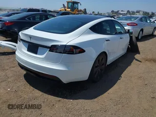 2023 Tesla Model S with VIN 5YJSA1E51PF499919, listed as a IAAI auction lot 42459166 with 6,612 mi miles and . Bid and sale history available at DreamBid. Image 4.