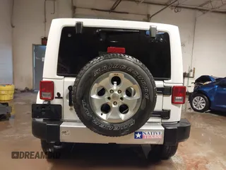 2014 Jeep Wrangler Unlimited Sahara with VIN 1C4BJWEG1EL326605, listed as a IAAI auction lot 41325037 with 135,824 mi miles. Bid and sale history available at carsss.com. Image 16.