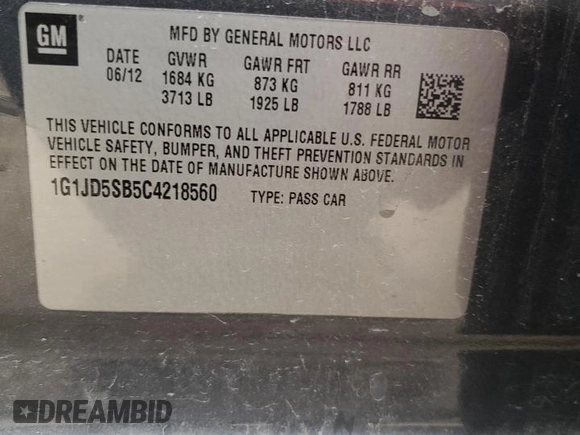 2012 Chevrolet Sonic LT z VIN 1G1JD5SB5C4218560, wystawiony jako Copart lot #75256184 z przebiegiem 182 339 mil mil oraz Szkoda całkowita • Salvage title. Historia ofert i sprzedaży dostępna na DreamBid. Obrazek 13.