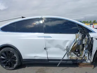2021 Tesla Model X Long Range Plus with VIN 5YJXCBE23MF321243, listed as a IAAI auction lot 42100580 with 59,878 mi miles and . Bid and sale history available at carsss.com. Image 13.