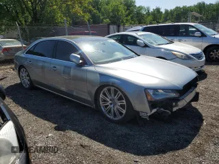 2012 Audi A8 z VIN WAURVAFDXCN001167, wystawiony jako Copart lot #57227105 z przebiegiem 154 409 mil mil oraz Szkoda całkowita • Salvage title. Historia ofert i sprzedaży dostępna na DreamBid. Obrazek 4.