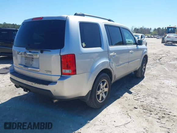 2011 Honda Pilot Touring with VIN 5FNYF4H91BB086712, listed as a IAAI auction lot 41809369 with 260,718 mi miles. Bid and sale history available at carsss.com. Image 4.