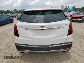 2024 Cadillac XT5 FWD Premium Luxury with VIN 1GYKNCRS9RZ706158, listed as a Copart auction lot 60455055 with 7,999 mi miles and Salvage title. Bid and sale history available at DreamBid. Image 6.