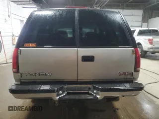 1999 GMC Yukon with VIN 1GKEK13R1XJ740648, listed as a Copart auction lot 82829084 with 211,002 mi miles and Salvage Title. Bid and sale history available at carsss.com. Image 6.