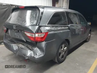 2012 Honda Odyssey Touring с VIN 5FNRL5H99CB047340, выставлен на аукционе IAAI как лот 41965189 с пробегом Не указан миль и . История ставок и продаж доступна на DreamBid. Изображение 4.