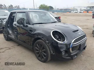 2020 MINI Hardtop 4 Door Cooper S z VIN WMWXU9C03L2M14737, wystawiony jako IAAI lot #42350071 z przebiegiem 36 375 mil mil oraz . Historia ofert i sprzedaży dostępna na DreamBid. Obrazek 1.