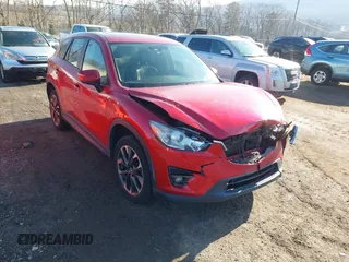 2016 Mazda CX-5 Grand Touring with VIN JM3KE4DYXG0908328, listed as a IAAI auction lot 41656600 with 102,791 mi miles. Bid and sale history available at carsss.com. Image 1.