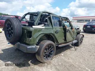 2023 Jeep Wrangler Sahara with VIN 1C4JJXP60PW556336, listed as a IAAI auction lot 39553199 with 10,437 mi miles and . Bid and sale history available at DreamBid. Image 4.
