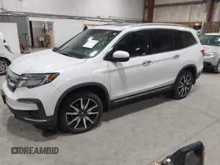 2022 Honda Pilot Touring 7-Passenger with VIN 5FNYF6H63NB063857, listed as a IAAI auction lot 41936941 with 54,424 mi miles. Bid and sale history available at carsss.com. Image 20.