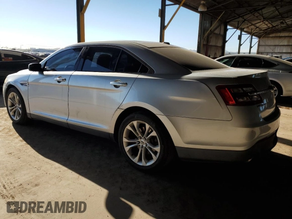 2013 Ford Taurus SEL with VIN 1FAHP2E86DG102656, listed as a Copart auction lot 50393805 with 212,804 mi miles and Clean Title. Bid and sale history available at carsss.com. Image 2.