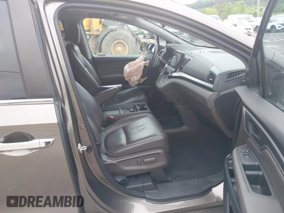 2018 Honda Odyssey Touring with VIN 5FNRL6H89JB057148, listed as a IAAI auction lot 42511909 with 166,438 mi miles and . Bid and sale history available at DreamBid. Image 5.