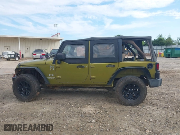 2007 Jeep Wrangler Unlimited X with VIN 1J4GA39177L164566, listed as a IAAI auction lot 42588655 with 50,915 mi miles and . Bid and sale history available at DreamBid. Image 14.