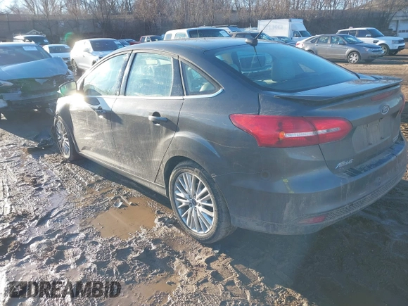 2015 Ford Focus Titanium with VIN 1FADP3J28FL348625, listed as a IAAI auction lot 41674741 with 223,585 mi miles and . Bid and sale history available at carsss.com. Image 3.