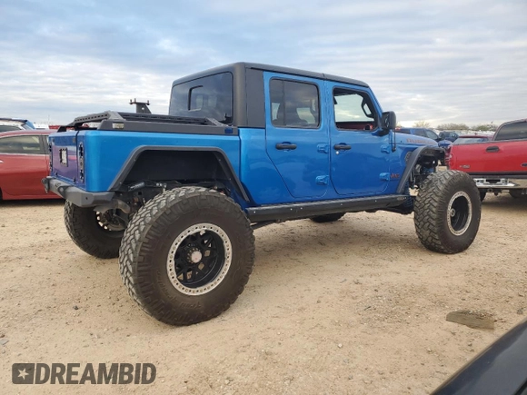 2021 Jeep Gladiator Rubicon with VIN 1C6JJTBM1ML611203, listed as a Copart auction lot 87203924 with 27,645 mi miles and Salvage title. Bid and sale history available at DreamBid. Image 3.