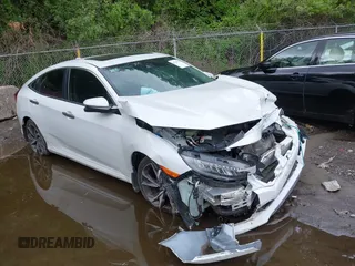 2020 Honda Civic Touring z VIN 19XFC1F91LE210390, wystawiony jako IAAI lot #42335713 z przebiegiem 67 269 mil mil oraz . Historia ofert i sprzedaży dostępna na DreamBid. Obrazek 1.