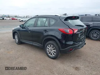 2016 Mazda CX-5 Sport with VIN JM3KE2BY4G0761933, listed as a IAAI auction lot 41709274 with 131,127 mi miles. Bid and sale history available at carsss.com. Image 3.