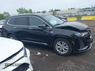 2024 Cadillac XT6 AWD Luxury z VIN 1GYKPBR49RZ723838, wystawiony jako IAAI lot #42346554 z przebiegiem 27 525 mil mil oraz . Historia ofert i sprzedaży dostępna na DreamBid. Obrazek 13.