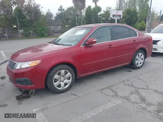 2009 Kia Optima LX with VIN KNAGE228095312766, listed as a IAAI auction lot 42074522 with 183,240 mi miles. Bid and sale history available at carsss.com. Image 2.