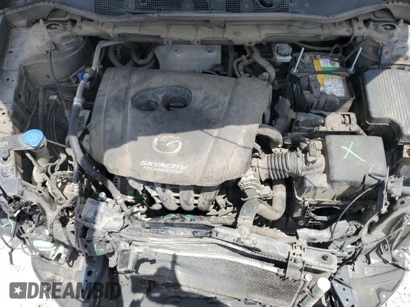 2014 Mazda CX-5 Sport z VIN JM3KE2BE8E0421316, wystawiony jako Copart lot #56548005 z przebiegiem 203 096 mil mil oraz Szkoda całkowita • Salvage title. Historia ofert i sprzedaży dostępna na DreamBid. Obrazek 11.