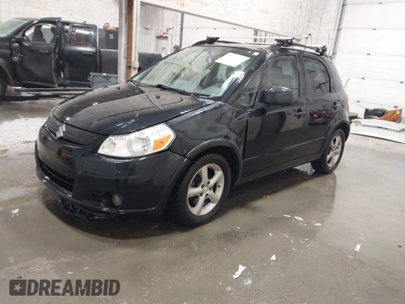2009 Suzuki SX4 Man AWD with VIN JS2YB413596200885, listed as a IAAI auction lot 41189776 with 111,891 mi miles. Bid and sale history available at carsss.com. Image 2.