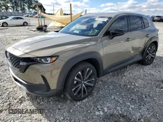 2023 Mazda CX-50 Premium z VIN 7MMVABDY7PN111138, wystawiony jako Copart lot #64731582 z przebiegiem 3917 mil mil oraz . Historia ofert i sprzedaży dostępna na DreamBid. Obrazek 2.