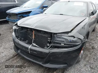 2015 Dodge Charger SE with VIN 2C3CDXBG7FH841469, listed as a IAAI auction lot 42001599 with 103,342 mi miles and . Bid and sale history available at DreamBid. Image 6.