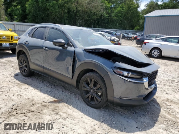 2022 Mazda CX-30 S Carbon Edition с VIN 3MVDMBCL0NM434395, выставлен на аукционе Copart как лот 56247715 с пробегом 40 698 миль миль и На запчасти • Non repairable. История ставок и продаж доступна на DreamBid. Изображение 4.