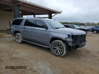 2018 Chevrolet Suburban Premier with VIN 1GNSCJKC5JR293962, listed as a Copart auction lot 50641835 with 137,598 mi miles and Salvage Title. Bid and sale history available at DreamBid. Image 4.