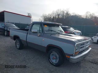 1988 Dodge D/W 100 with VIN 1B7FD04X9JS676023, listed as a IAAI auction lot 40746708 with 98,215 mi miles. Bid and sale history available at carsss.com. Image 1.