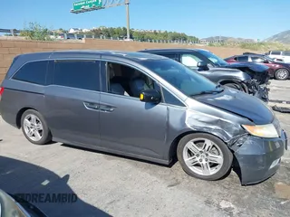 2011 Honda Odyssey Touring with VIN 5FNRL5H96BB009580, listed as a IAAI auction lot 42202595 with Not provided miles and . Bid and sale history available at DreamBid. Image 13.