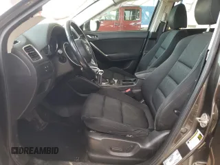 2016 Mazda CX-5 Touring z VIN JM3KE2CY4G0805072, wystawiony jako Copart lot #58435535 z przebiegiem 146 323 mil mil oraz Szkoda całkowita • Salvage title. Historia ofert i sprzedaży dostępna na DreamBid. Obrazek 7.