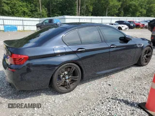 2016 BMW M5 z VIN WBSFV9C55GD595799, wystawiony jako Copart lot #65708864 z przebiegiem 104 198 mil mil oraz Szkoda całkowita • Salvage title. Historia ofert i sprzedaży dostępna na DreamBid. Obrazek 3.