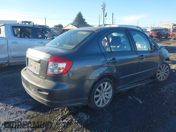 2010 Suzuki SX4 with VIN JS2YC5A40A6300053, listed as a IAAI auction lot 41392061 with 114,863 mi miles and . Bid and sale history available at DreamBid. Image 4.