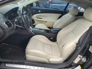 2013 Jaguar XK with VIN SAJWA4FB3DLB50331, listed as a Copart auction lot 66573384 with 109,887 mi miles and Salvage Title. Bid and sale history available at carsss.com. Image 7.