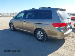 2010 Honda Odyssey EX-L with VIN 5FNRL3H79AB048049, listed as a IAAI auction lot 41440910 with 142,385 mi miles. Bid and sale history available at carsss.com. Image 3.