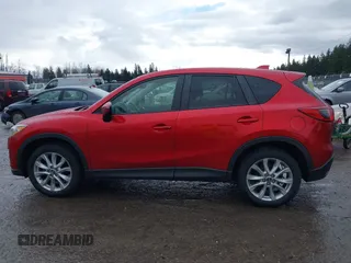 2015 Mazda CX-5 Grand Touring with VIN JM3KE4DY0F0479392, listed as a IAAI auction lot 41659415 with 141,403 mi miles. Bid and sale history available at carsss.com. Image 14.