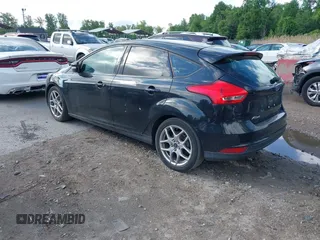 2015 Ford Focus SE with VIN 1FADP3K2XFL319559, listed as a IAAI auction lot 42205107 with 184,499 mi miles. Bid and sale history available at carsss.com. Image 3.