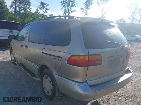 2000 Toyota Sienna LE with VIN 4T3ZF13C1YU301224, listed as a IAAI auction lot 42176695 with 203,971 mi miles and . Bid and sale history available at DreamBid. Image 3.