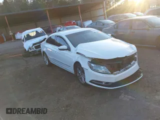 2014 Volkswagen CC R-Line with VIN WVWBP7AN0EE521995, listed as a IAAI auction lot 41213732 with 113,421 mi miles. Bid and sale history available at carsss.com. Image 1.