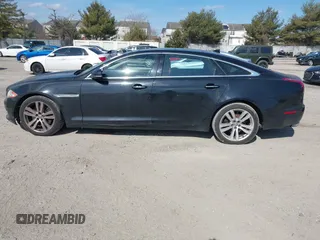 2013 Jaguar XJ Portfolio with VIN SAJWJ2GDXD8V55879, listed as a IAAI auction lot 41568366 with 121,119 mi miles and . Bid and sale history available at DreamBid. Image 14.