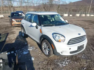 2014 MINI Countryman with VIN WMWZB3C58EWM32024, listed as a IAAI auction lot 41594143 with 209,792 mi miles and . Bid and sale history available at DreamBid. Image 1.