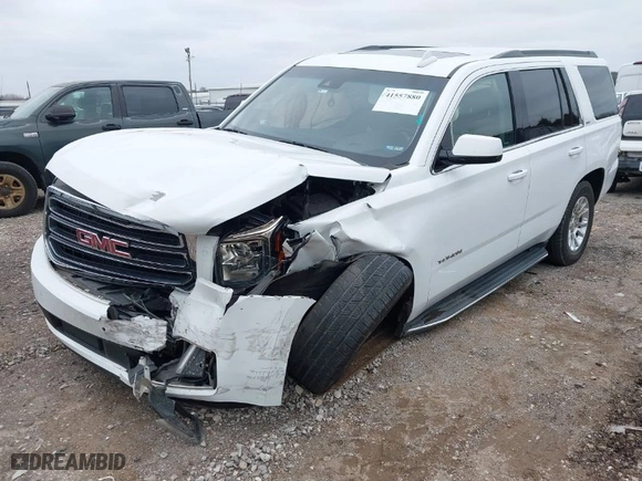2019 GMC Yukon SLT with VIN 1GKS2BKC6KR183607, listed as a IAAI auction lot 41557880 with 120,971 mi miles. Bid and sale history available at carsss.com. Image 2.