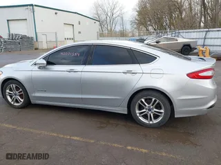 2015 Ford Fusion Titanium Hybrid with VIN 3FA6P0RU8FR181312, listed as a IAAI auction lot 42071584 with 99,955 mi miles. Bid and sale history available at carsss.com. Image 14.