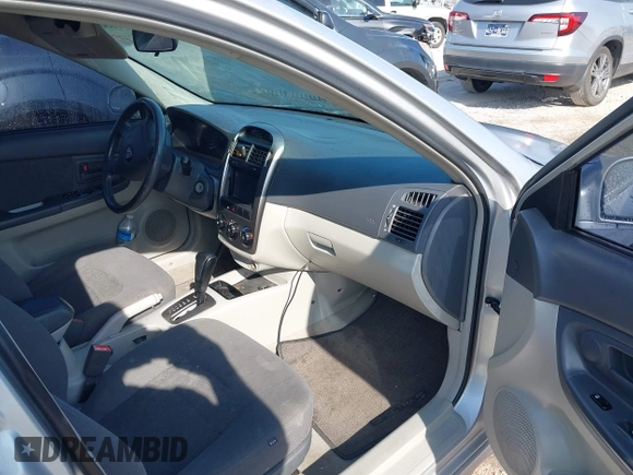 2006 Kia Spectra with VIN KNAFE161365208111, listed as a IAAI auction lot 41886193 with 292,535 mi miles. Bid and sale history available at carsss.com. Image 5.