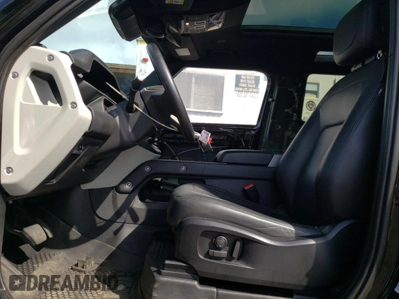 2023 Land Rover Defender S with VIN SALEJ6EX0P2173858, listed as a Copart auction lot 52773365 with 30,768 mi miles and Salvage title. Bid and sale history available at DreamBid. Image 7.