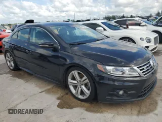 2014 Volkswagen CC R-Line with VIN WVWAN7AN5EE534548, listed as a Copart auction lot 61730364 with 104,545 mi miles and Salvage Title. Bid and sale history available at carsss.com. Image 4.