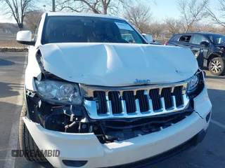 2012 Jeep Grand Cherokee Laredo with VIN 1C4RJFAG5CC310893, listed as a IAAI auction lot 41695279 with 136,821 mi miles. Bid and sale history available at carsss.com. Image 6.