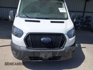 2022 Ford Transit Cargo with VIN 1FTBW3X89NKA69141, listed as a IAAI auction lot 41980864 with 102,721 mi miles and . Bid and sale history available at DreamBid. Image 6.